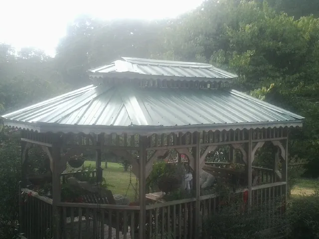 Two tier green metal roof on a garden gazebo in Netawaka